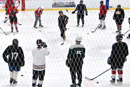 People learning to play hockey
