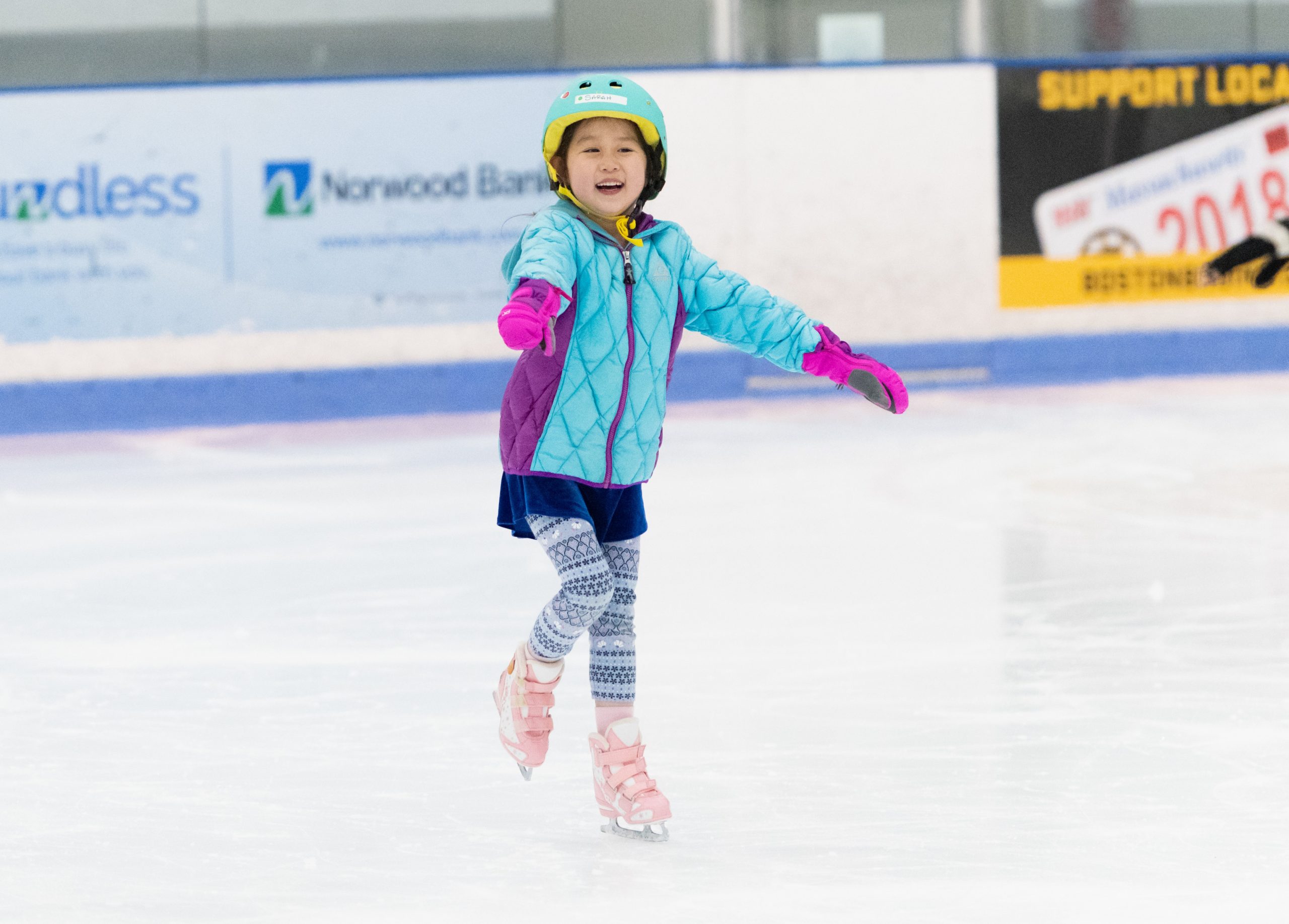 DSC_4762 Little girl in helmet smiling while skating on one foot