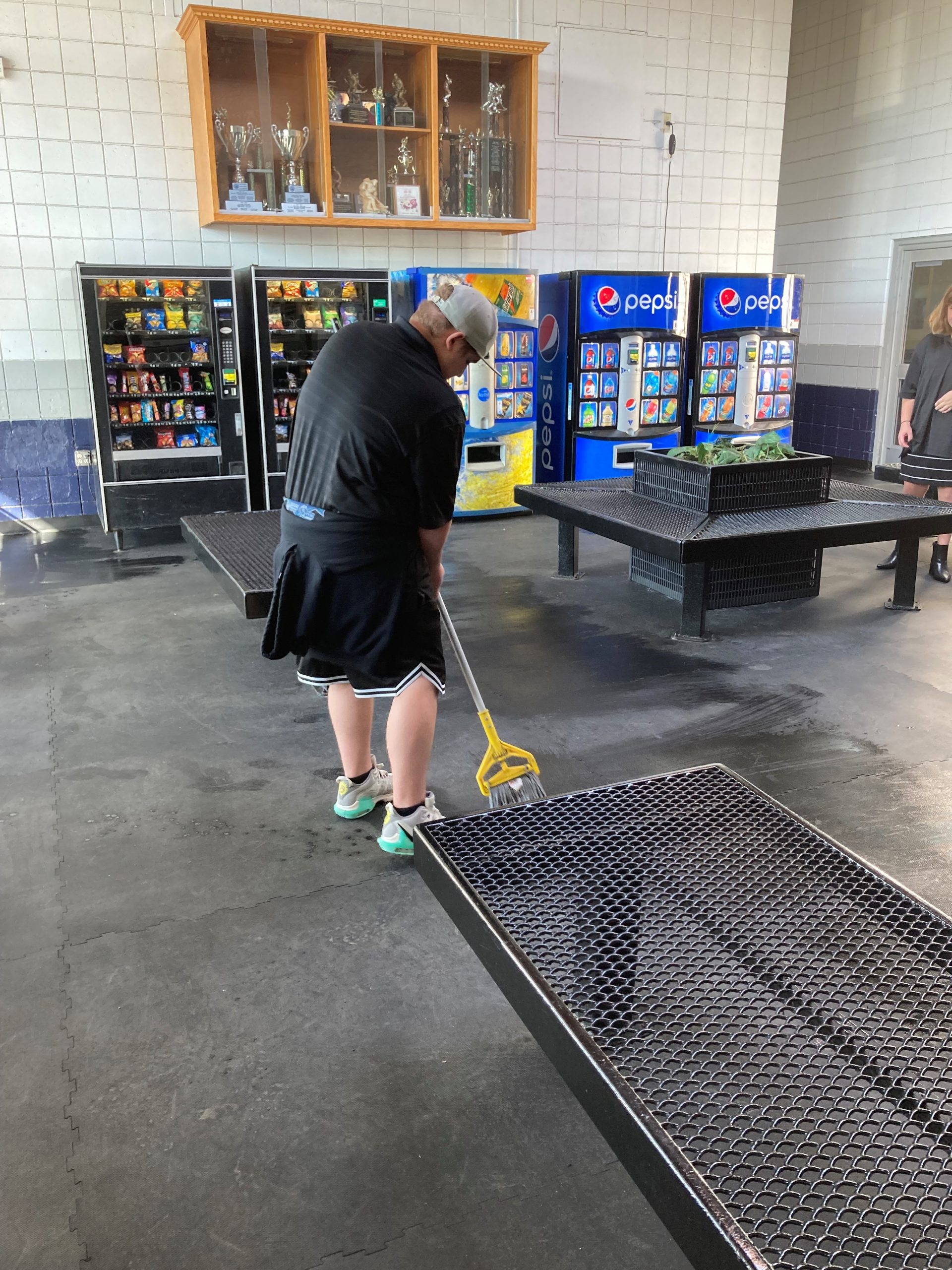Man mopping rink floor