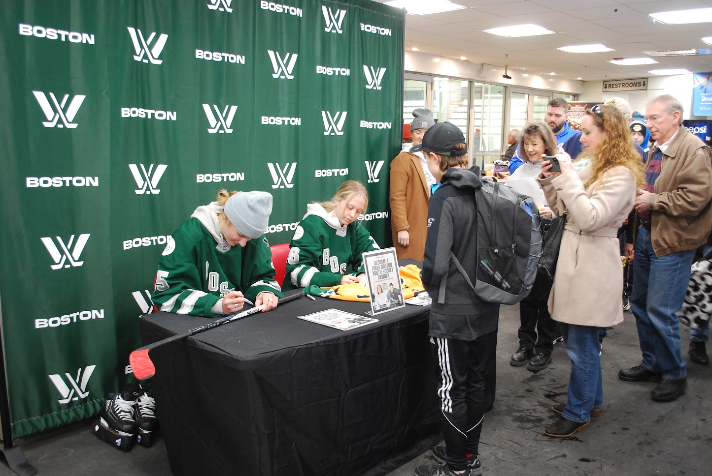 WHL Boston hockey team players signing a boys hockey stick