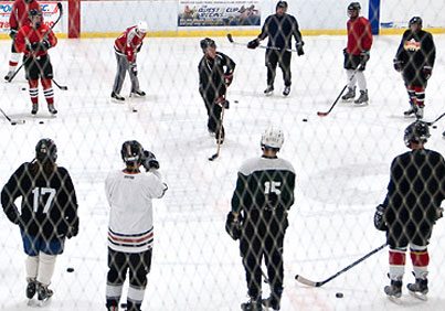 People learning to play hockey