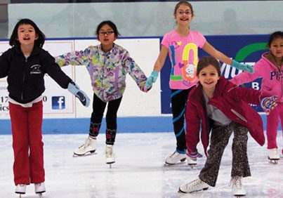 Children practicing ice skating