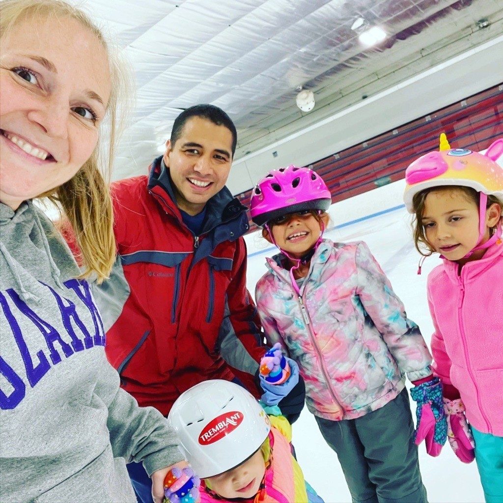 Family-SSSD-1 Family of five smiling on ice for a group selfie